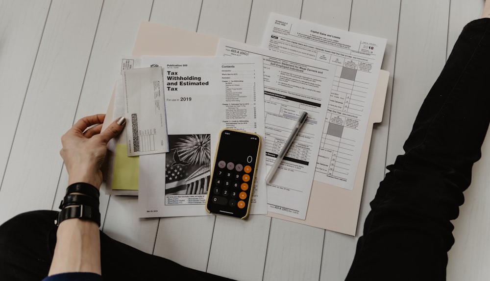 Financial documents and calculations on a desk